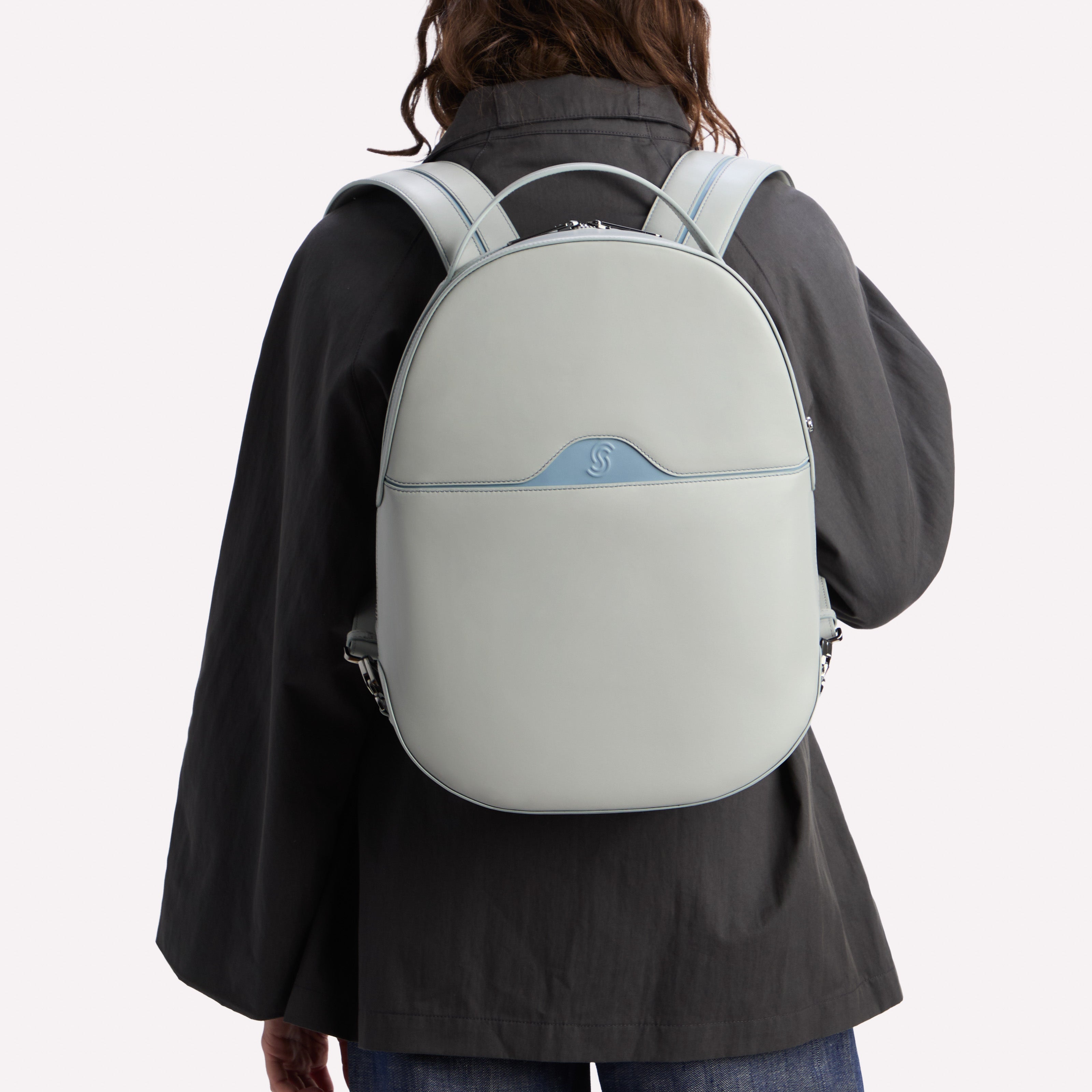 Model wearing a Cezanne & Lavanda Bellagio backpack on a white background