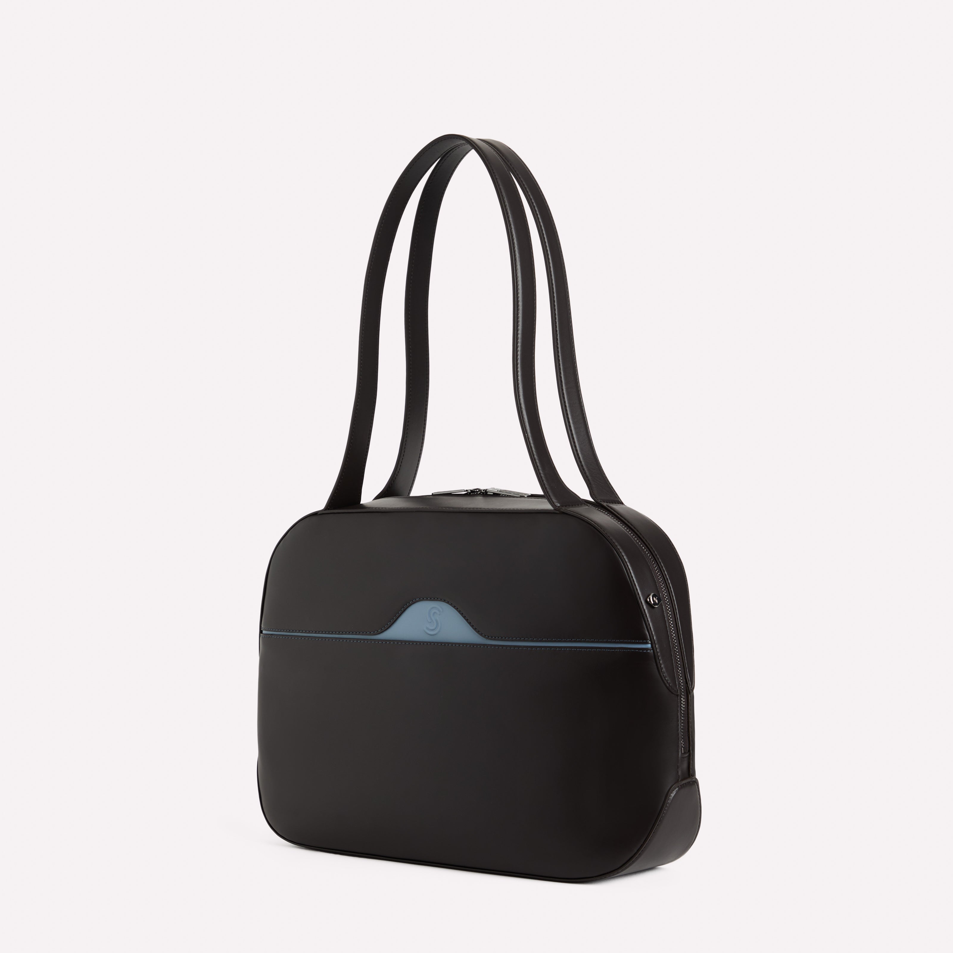 Black handbag with a blue pocket on a white background