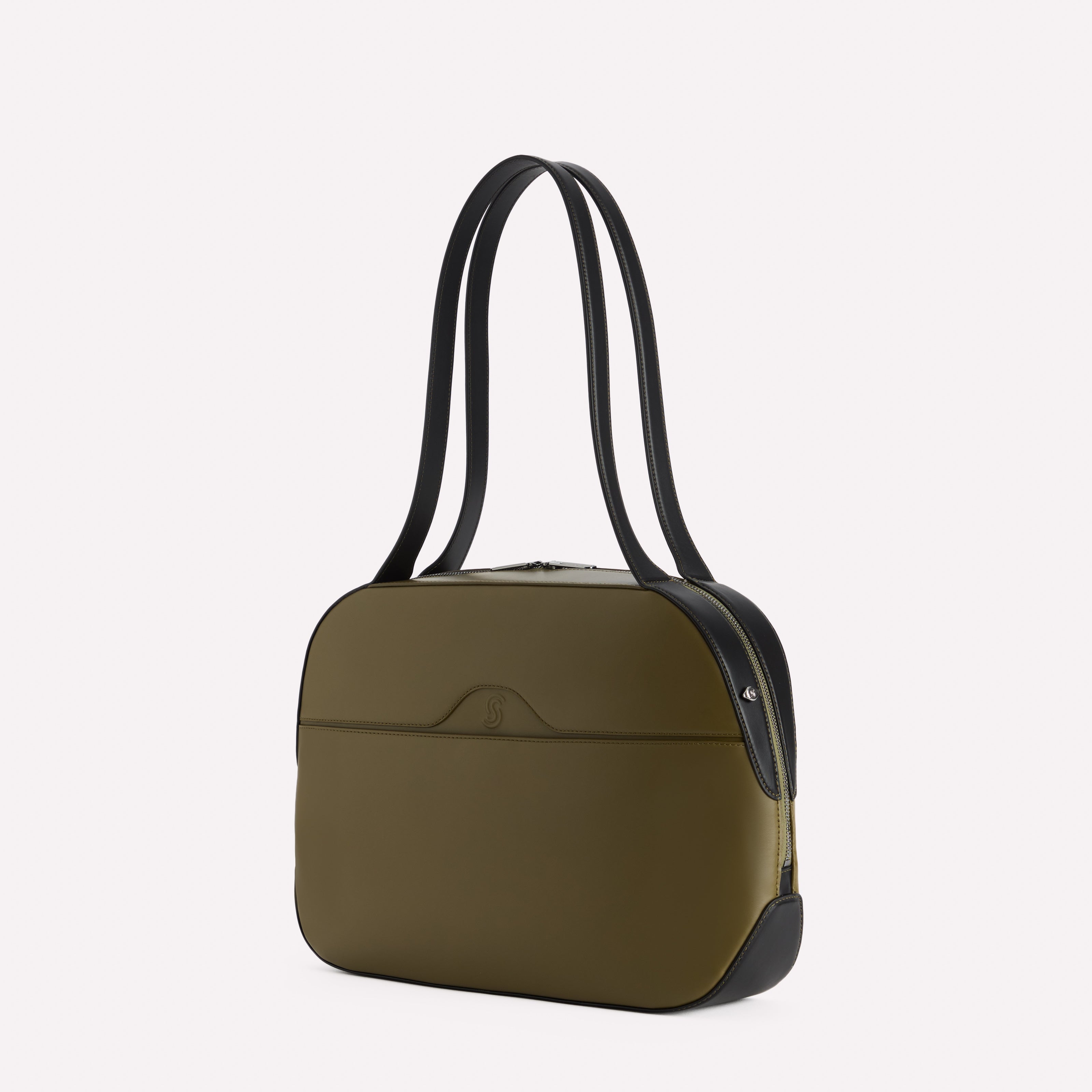 Green handbag with black strap on a white background